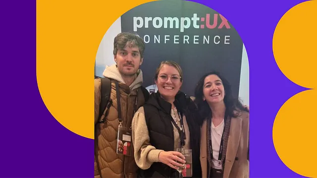 Three members of our design community stand in fron of a PromptUX conference sign, smiling